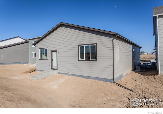 692 Galloway Dr, Johnstown, CO 80534 - back of house featuring central air condition unit