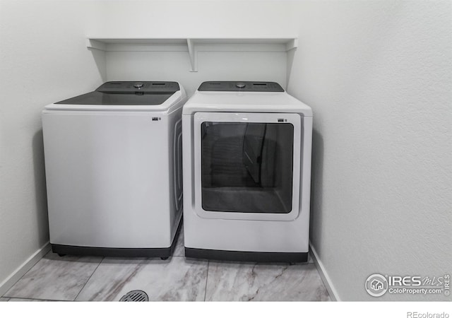 692 Galloway Dr, Johnstown, CO 80534 - laundry area featuring separate washer and dryer and baseboards