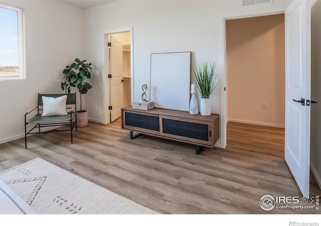 692 Galloway Dr, Johnstown, CO 80534 - sitting room with wood finished floors and baseboards