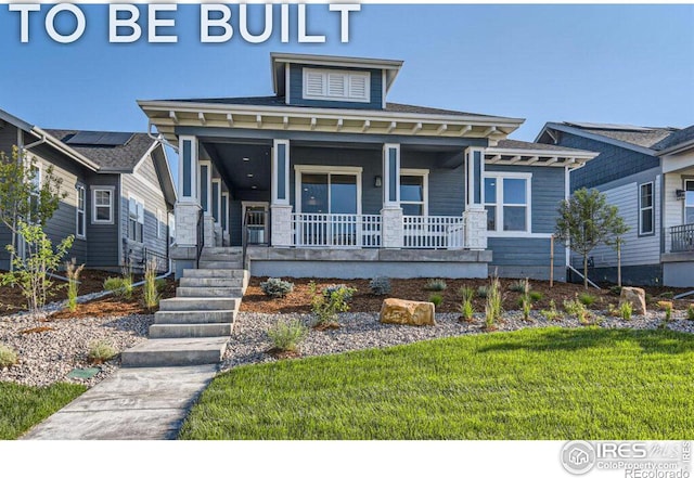 view of front of property featuring a front lawn and a porch