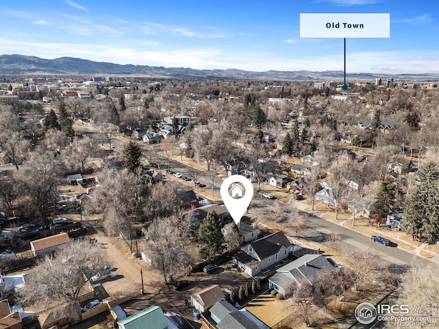 birds eye view of property with a mountain view