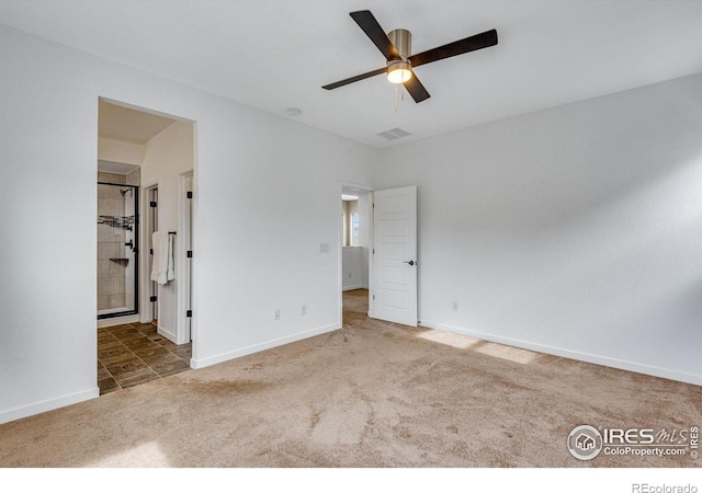 unfurnished bedroom with baseboards, visible vents, a ceiling fan, connected bathroom, and carpet flooring