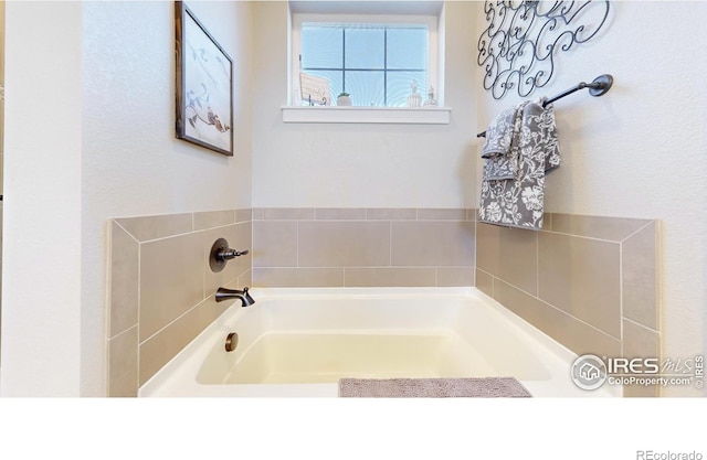 bathroom featuring a washtub