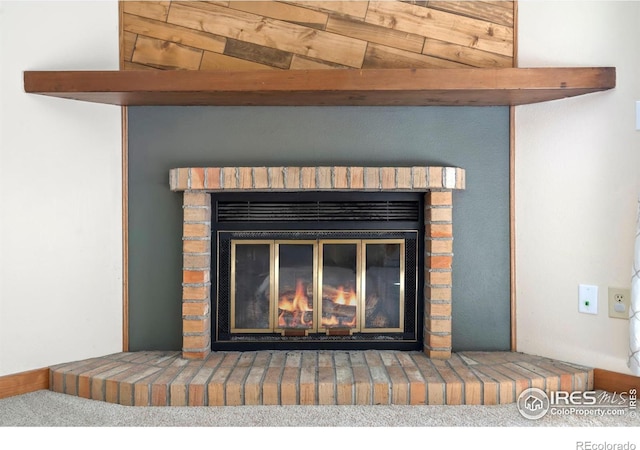 details featuring a brick fireplace