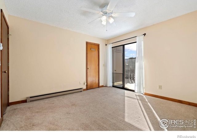 carpeted spare room featuring a baseboard radiator, baseboards, a textured ceiling, and ceiling fan