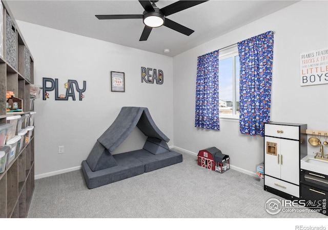 game room featuring ceiling fan and carpet