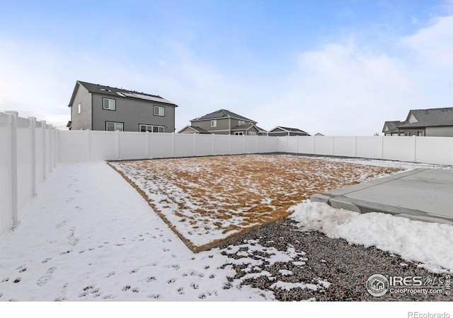 view of yard covered in snow