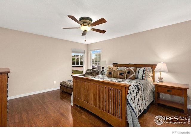 bedroom featuring dark hardwood / wood-style floors and ceiling fan