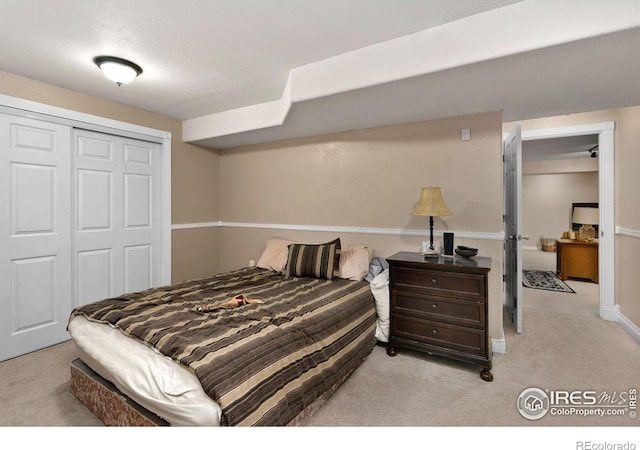 carpeted bedroom featuring a closet