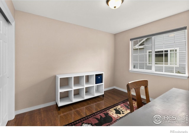 office area with dark wood-type flooring