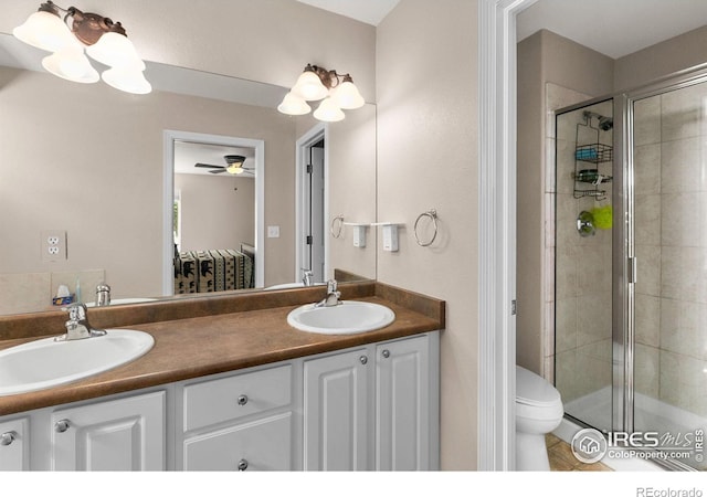 1421 Snipe Ln, Fort Collins, CO 80524 - bathroom featuring double vanity, a shower stall, toilet, and a sink