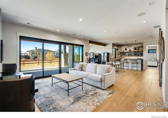 living room with light hardwood / wood-style floors