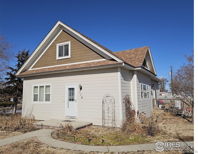 bungalow with roof with shingles