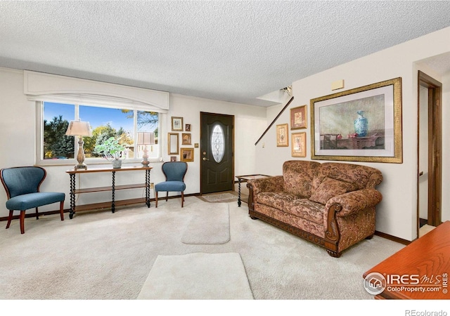 living room with a textured ceiling, carpet, and baseboards