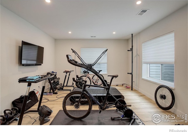 workout area with light wood-type flooring