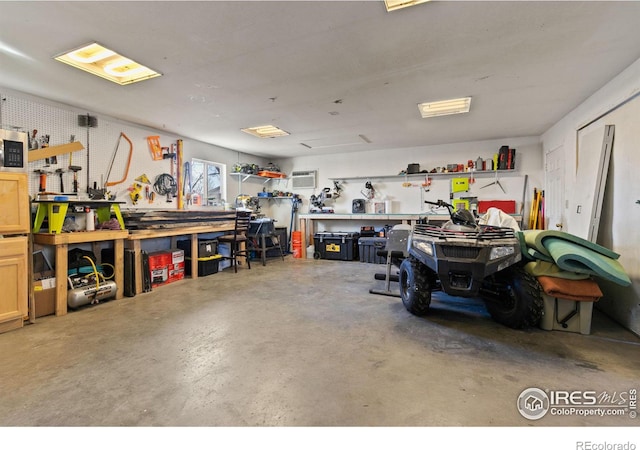 garage with a workshop area