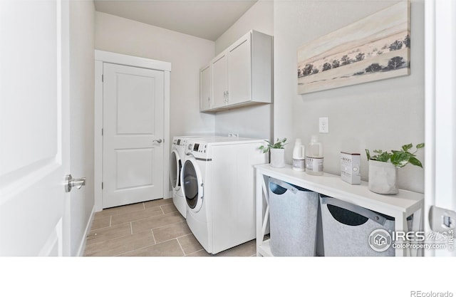 laundry room with cabinet space and independent washer and dryer