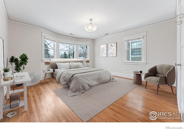 851 14th St, Boulder, CO 80302 - bedroom featuring baseboards, ornamental molding, and light wood-style flooring