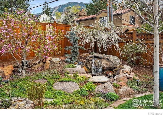 851 14th St, Boulder, CO 80302 - view of yard with a fenced backyard and a mountain view
