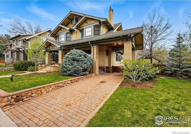851 14th St, Boulder, CO 80302 - craftsman inspired home featuring a chimney, a front lawn, and brick siding