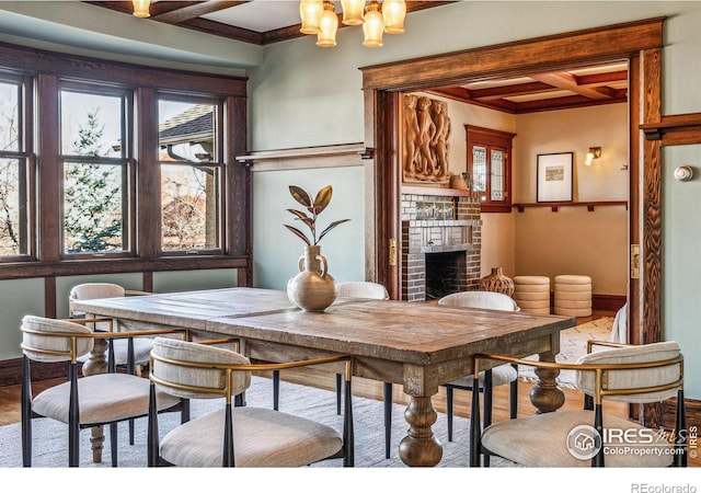 851 14th St, Boulder, CO 80302 - dining room with coffered ceiling, a fireplace, beamed ceiling, wood finished floors, and ornamental molding
