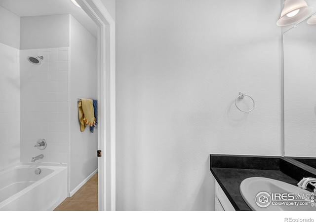 887 Sundance Ln, Erie, CO 80516 - bathroom featuring vanity, shower / washtub combination, and tile patterned flooring
