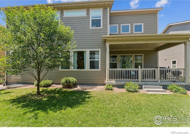 887 Sundance Ln, Erie, CO 80516 - view of front of property with a porch and a front yard