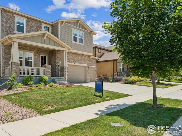 887 Sundance Ln, Erie, CO 80516 - craftsman-style home featuring stone siding, an attached garage, covered porch, and board and batten siding
