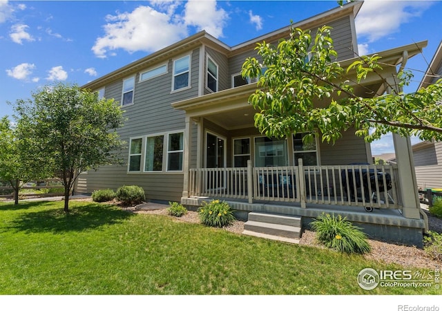 887 Sundance Ln, Erie, CO 80516 - back of property with a porch and a yard