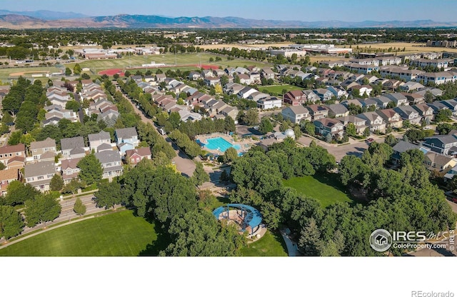 drone / aerial view featuring a residential view and a mountain view