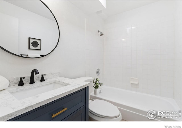 full bath featuring bathtub / shower combination, vanity, and toilet