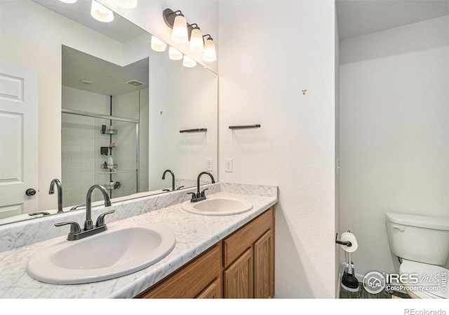 3510 Valleywood Ct, Johnstown, CO 80534 - full bath featuring a stall shower, double vanity, and toilet