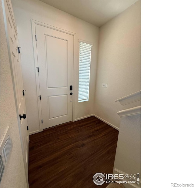 3510 Valleywood Ct, Johnstown, CO 80534 - entryway featuring dark wood-style floors and baseboards