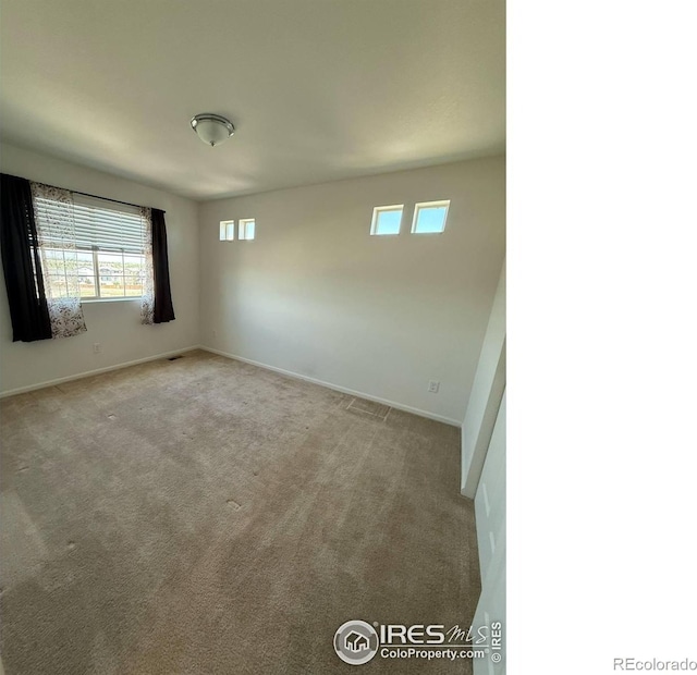 3510 Valleywood Ct, Johnstown, CO 80534 - spare room featuring plenty of natural light, carpet, and baseboards