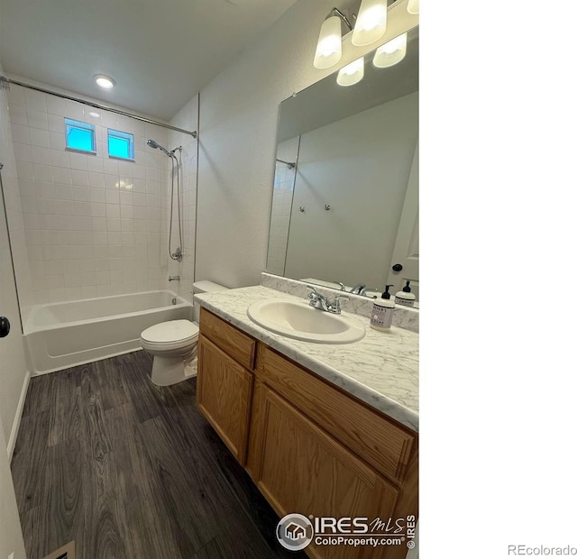 3510 Valleywood Ct, Johnstown, CO 80534 - bathroom featuring wood finished floors, toilet, vanity, and shower / bath combination