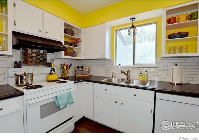 kitchen featuring white cabinetry, electric range, decorative light fixtures, exhaust hood, and sink