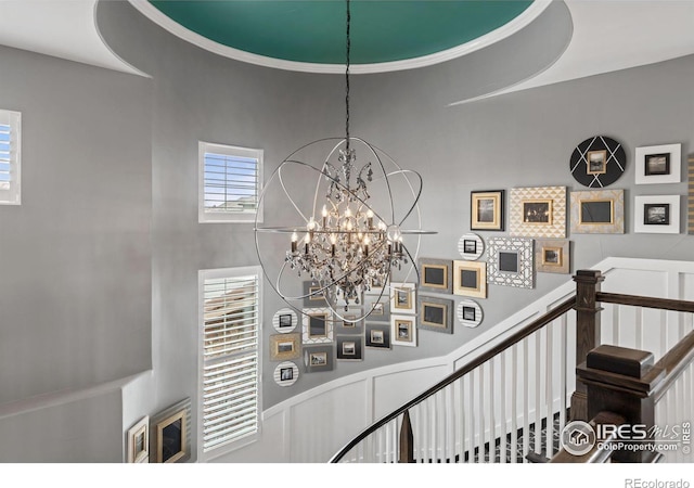 room details with an inviting chandelier and crown molding