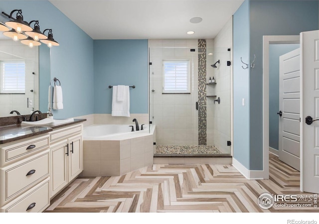 bathroom with vanity, plus walk in shower, and parquet floors