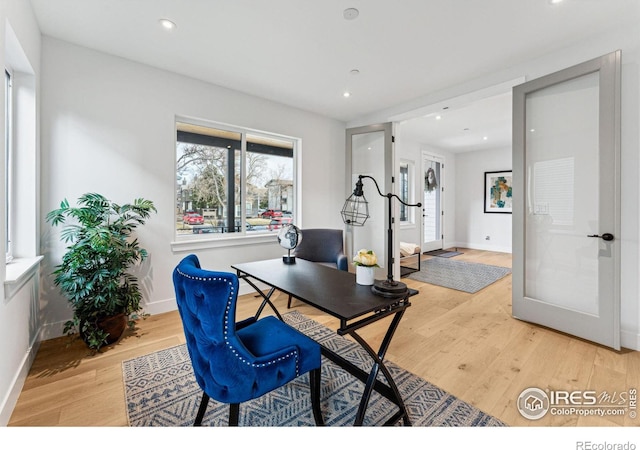 office with recessed lighting, light wood-style flooring, and baseboards