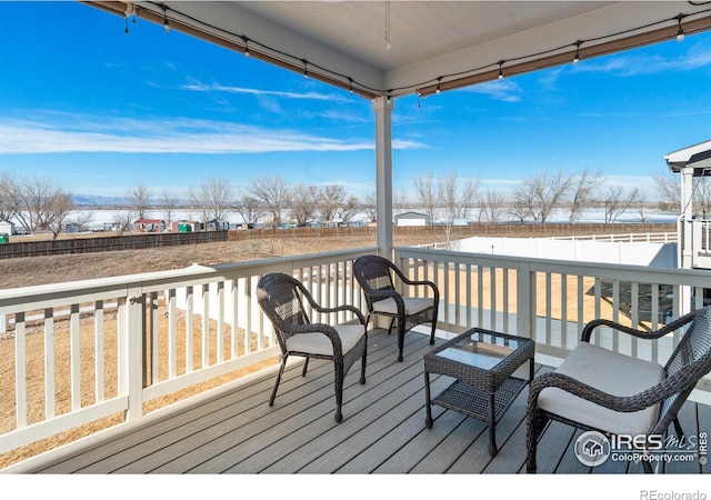 deck with a fenced backyard