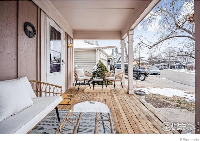 wooden deck featuring covered porch