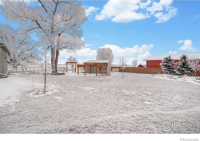 snowy yard with fence and a pergola
