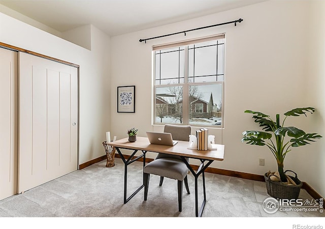 office area with baseboards and light colored carpet