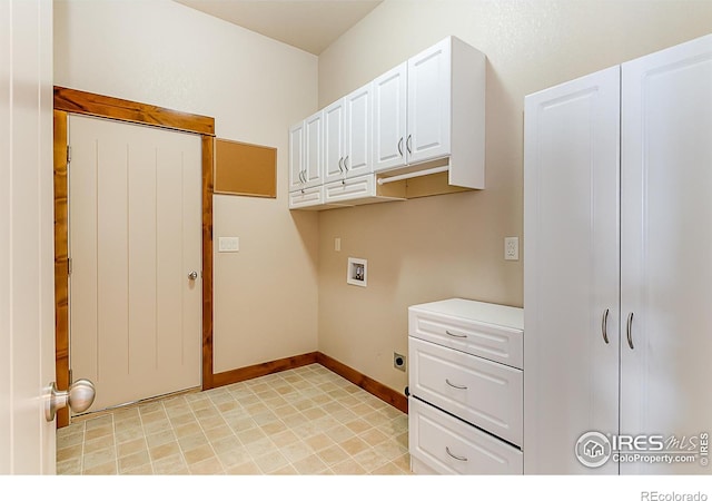 laundry room with cabinet space, hookup for an electric dryer, washer hookup, and baseboards