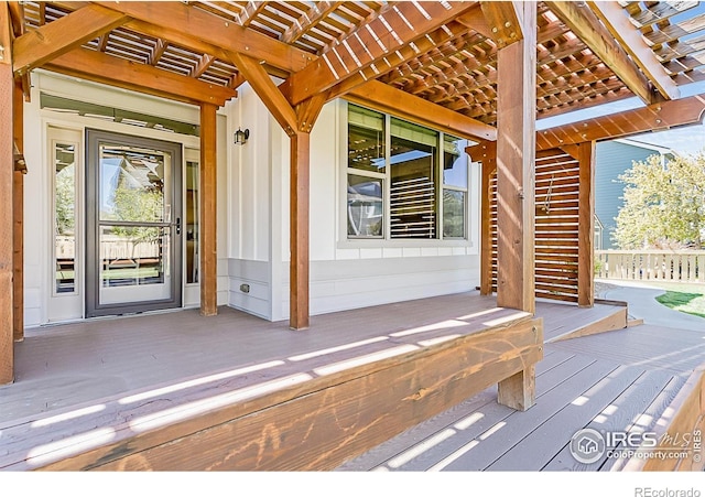 wooden deck featuring a pergola