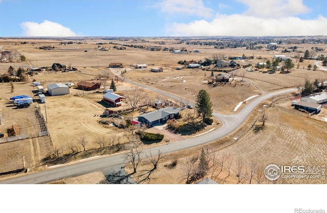 drone / aerial view with view of desert and a rural view