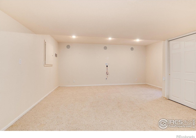 unfurnished room featuring recessed lighting and baseboards