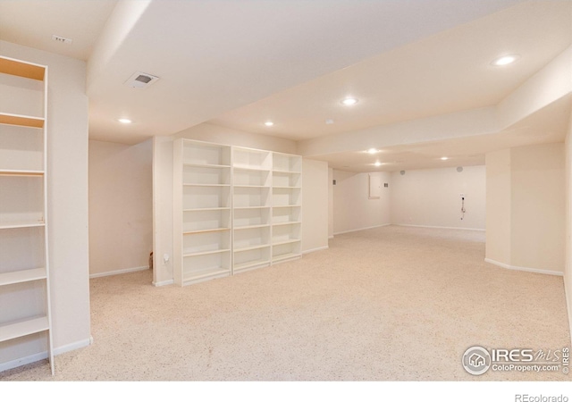 finished basement with recessed lighting, visible vents, light carpet, and baseboards