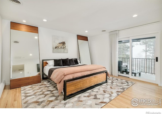 bedroom with access to exterior, recessed lighting, visible vents, and light wood-style flooring