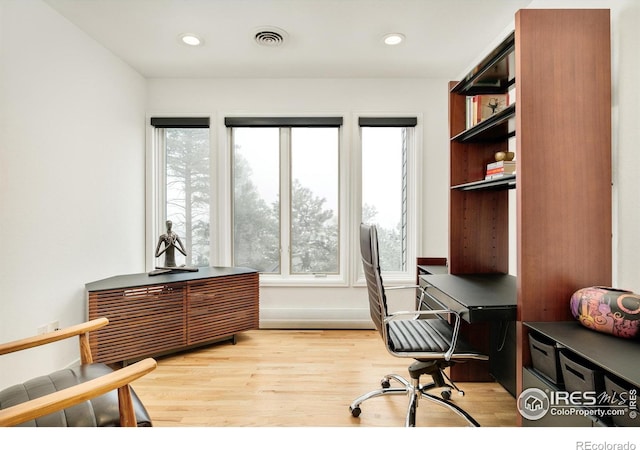 office space with recessed lighting, visible vents, and light wood-style floors